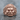 Fudo Myoo Ring, rose gold, front view on stone surface