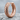 Dragon Scale Hoop Earring, rose gold vermeil, side angle on stone base