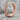 Ouroboros Serpent Hoop Earring, black rhodium plated, angled side view on rock