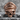 Marine Skull Ring, rose gold, front view product photo on stone