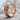 Flared Cross Ring, rose gold plated, angled product photo on stone surface