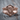 Praying Jesus Ring, rose gold, front angled view on wood