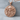 Skull Guns Pendant, rose gold, product photo on stone display
