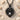White Topaz Love Knot Pendant, black rhodium plated, front product photo