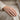 Chevron groove ring in rose gold, worn on model hand