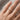 Rounded Square Tube Ring worn on model hand, product photo
