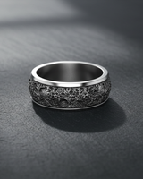 Silver lunar crater ring with a detailed moon surface texture, shown at an angle on a dark slate surface with soft lighting.