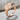 Oval Kintsugi Signet Ring, rose gold, angled view on stone