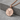 Kintsugi Disc Pendant, rose gold finish, product photo on stone