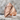 Faceted Zihgir Archer Ring, rose gold plated, angled view on stone