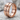 Repaired Brutalist Ring, rose gold finish, product photo on stone