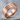Brutalist Kintsugi Staple Ring, rose gold finish, three-quarter view on stone