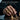 Iron Sharpens Iron Ring, gold vermeil, worn on model hand playing chess