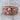 Calavera Skull Ring, rose gold, product photo on wood surface
