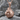Championship belt boxing speedbag pendant, rose plated silver, front view on stone