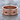 Fleur-de-lis Cross Band Ring, rose gold, product photo on stone surface