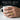 Saints Peter and Paul ring, gold vermeil, worn on model hand holding a mug