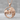 Lion Lioness Pendant, rose gold, front view on stone surface