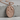 Skeleton Lovers Medallion Pendant, rose gold, front view on stone surface