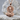 Sacred Heart Nimbus Jesus Pendant, rose gold, front view on stone