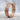 Dragon cuirass scale ring, rose gold, standing on stone surface