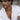 Model wearing the oxidized silver Aztec Macuahuitl pendant necklace with an unbuttoned white linen shirt