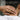 Lifestyle view of a cute sleeping dragon wrap ring worn on hand with guard your sleep banner background