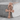 Egyptian ankh cross pendant, rose gold, front view on concrete block