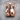Pair of Boxing Gloves Pendant, rose gold finish, product photo on wood