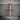Wood Grain Cross Pendant, rose gold finish, product photo on stone surface