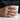 Hourglass Memento Mori Ring worn on model holding a cup