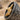 Close-up detail of 14K gold vermeil Anubis head and hammered silver texture on the side of the signet ring