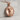 Ram Medallion Pendant, rose gold, product photo on stone