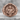 Archangel Uriel Ring, rose gold, front view on stone surface