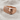 Skull Cloth Ring, rose gold finish, angled view on fabric