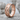 Infinity Love Ring, rose gold, angled product photo on stone