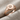 Star Set Signet Ring, rose gold finish, angled view on fabric