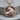 Rearing Taurus Zodiac Pendant, rose gold, product photo on wood