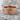 Thorn Band Ring in rose gold plated silver, front view on stone surface