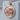London Skyline Pendant, rose gold, front view on stone display