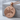 Eagle Yin Yang Pendant, rose gold, front view on stone pedestal