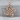 Quaternary Celtic Knot Pendant, rose gold, product photo on stone surface