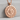 Aztec Sun Stone Relief Pendant, rose gold, angled studio view