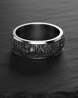 Overhead view of a 925 sterling silver lunar crater ring, highlighting the deep, varied craters and the smooth, polished inner band.