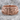 Lucky 13 Scroll Ring, rose gold, front view on stone surface