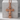 Palmette Orthodox Cross Pendant, rose gold, front view on stone pedestal