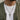 Model wearing oxidized silver crucifix cross pendant on chain styled with white t-shirt and green jacket