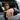 Lifestyle view of a man wearing the handcrafted demon skull ring on his hand while leaning out of a car window