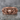 Motorcycle Skull Ring, rose gold, front view on stone