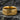 Gold vermeil mosaic band ring with textured cobblestone design on stone background
